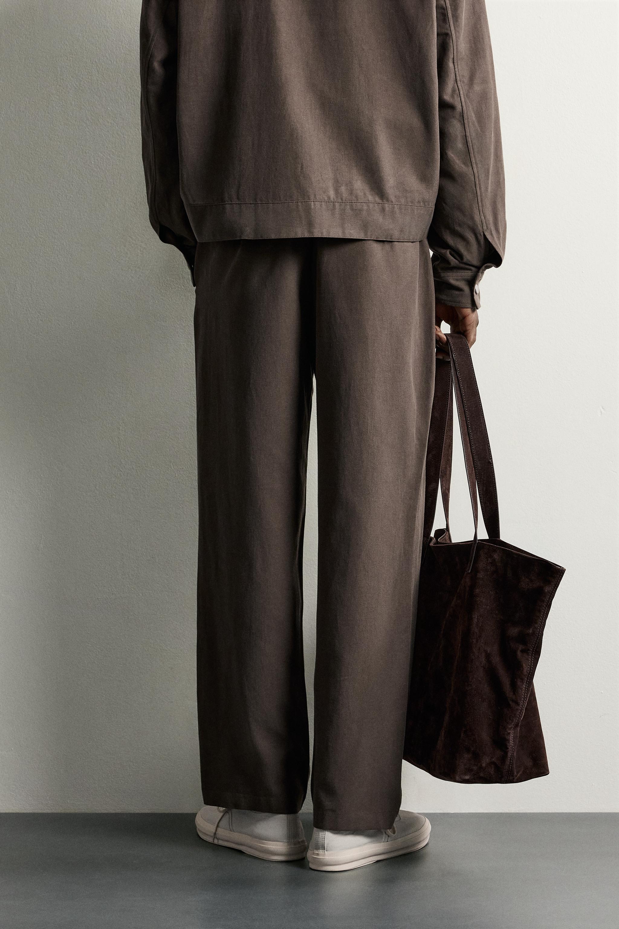 RELAXED FIT PLEATED PANTS